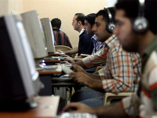 People browsing the Internet from an Internet cafe
