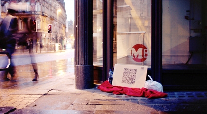 QR codes on cardboard? That’s one way to raise money for a UK homeless charity.