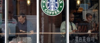 People use their laptop computers at a s