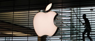 Employees walk up a flight of stairs pri